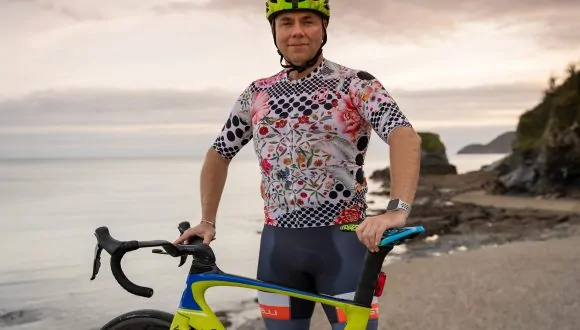 matt standing next to his bike preparing for ride the change to cop26