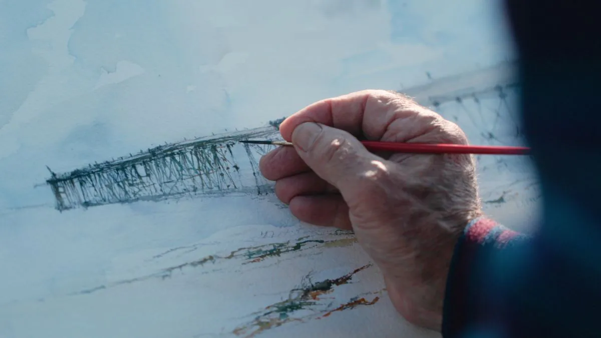 aging hand painting the pier in watercolours